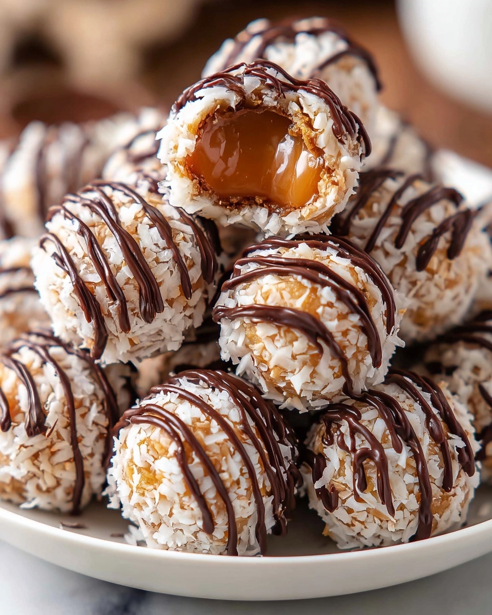 The image shows a close-up of small round truffles stacked in a white bowl on a white marbled surface. Each truffle has a base layer covered with shredded coconut, giving it a rough white and light brown texture. Over this, there is a thin drizzle of dark chocolate in thin lines all over each truffle, adding a shiny dark brown contrast. One truffle is cut open, revealing a soft, gooey caramel layer inside covered by a thin shell of dark chocolate. The whole scene has warm lighting and soft focus in the background, highlighting the texture and gloss of the truffles. Photo taken with an iphone --ar 4:5 --v 7