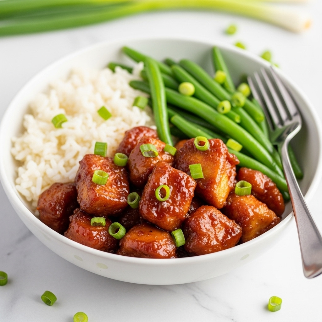 The image shows many pieces of fried chicken wings covered evenly with a shiny, thick, dark reddish-brown sauce that looks sticky and flavorful. Each wing piece is golden-brown underneath the saucy glaze and has a slightly crispy texture visible where the sauce is thinner. The wings are packed closely together, filling the frame fully, showing a rich and glossy surface with a mix of smooth and slightly bumpy textures from the fried coating and sauce. The background has a white marbled texture. photo taken with an iphone --ar 4:5 --v 7